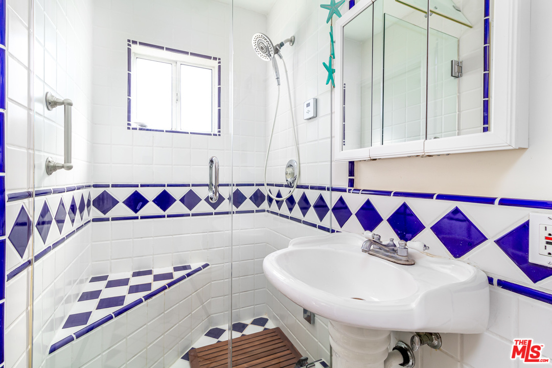 3938 Las Flores Canyon Road Malibu, CA 90265 - Photo 8 of 21 a bathroom with a sink and a mirror