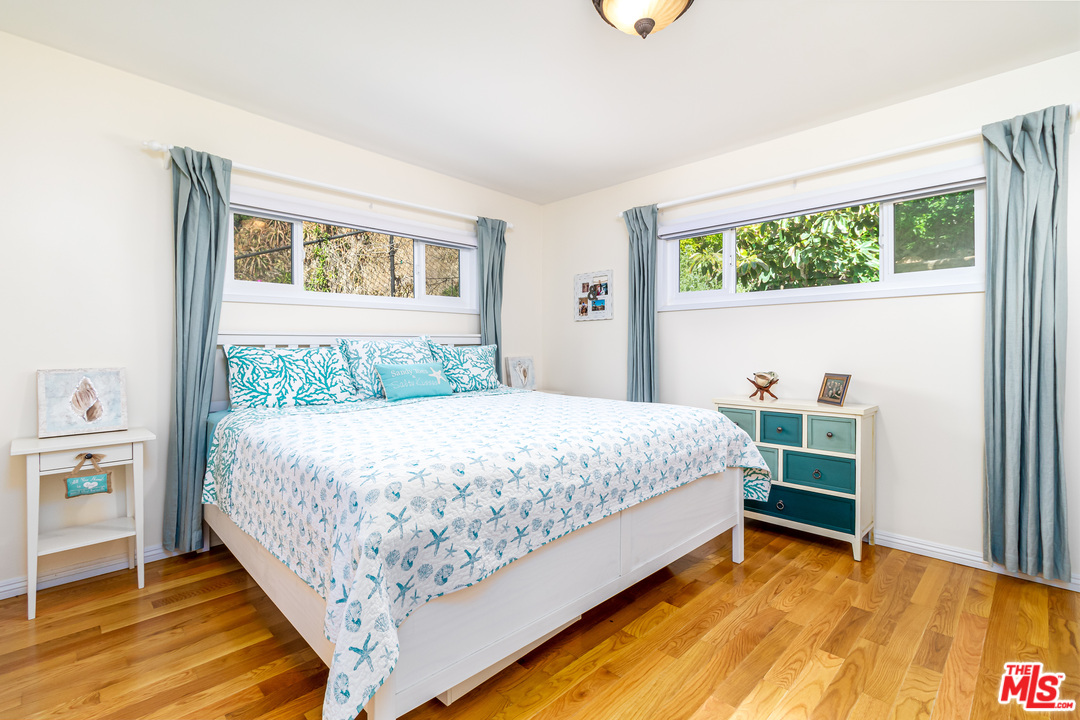 3938 Las Flores Canyon Road Malibu, CA 90265 - Photo 9 of 21 a bedroom with a bed and a window