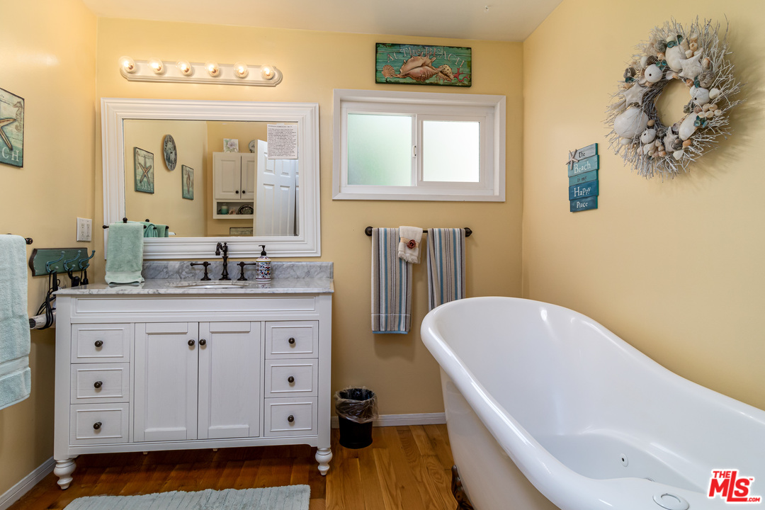 3938 Las Flores Canyon Road Malibu, CA 90265 - Photo 10 of 21 a bathroom with a tub sink and mirror