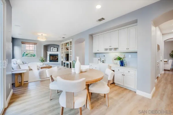 a view of kitchen with breakfast area and living room