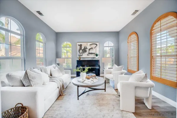 a living room with furniture and a large window