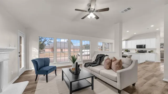 a living room with furniture and a large window