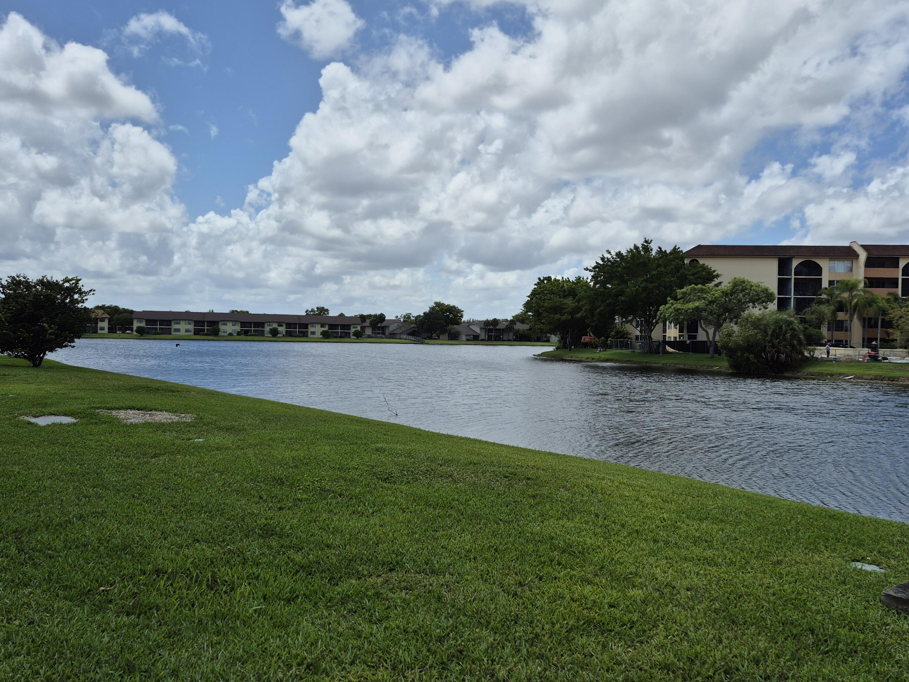 10039 Winding Lake Road, Unit 202 Sunrise, FL 33351 - Photo 3 of 14 a view of a terrace with a garden