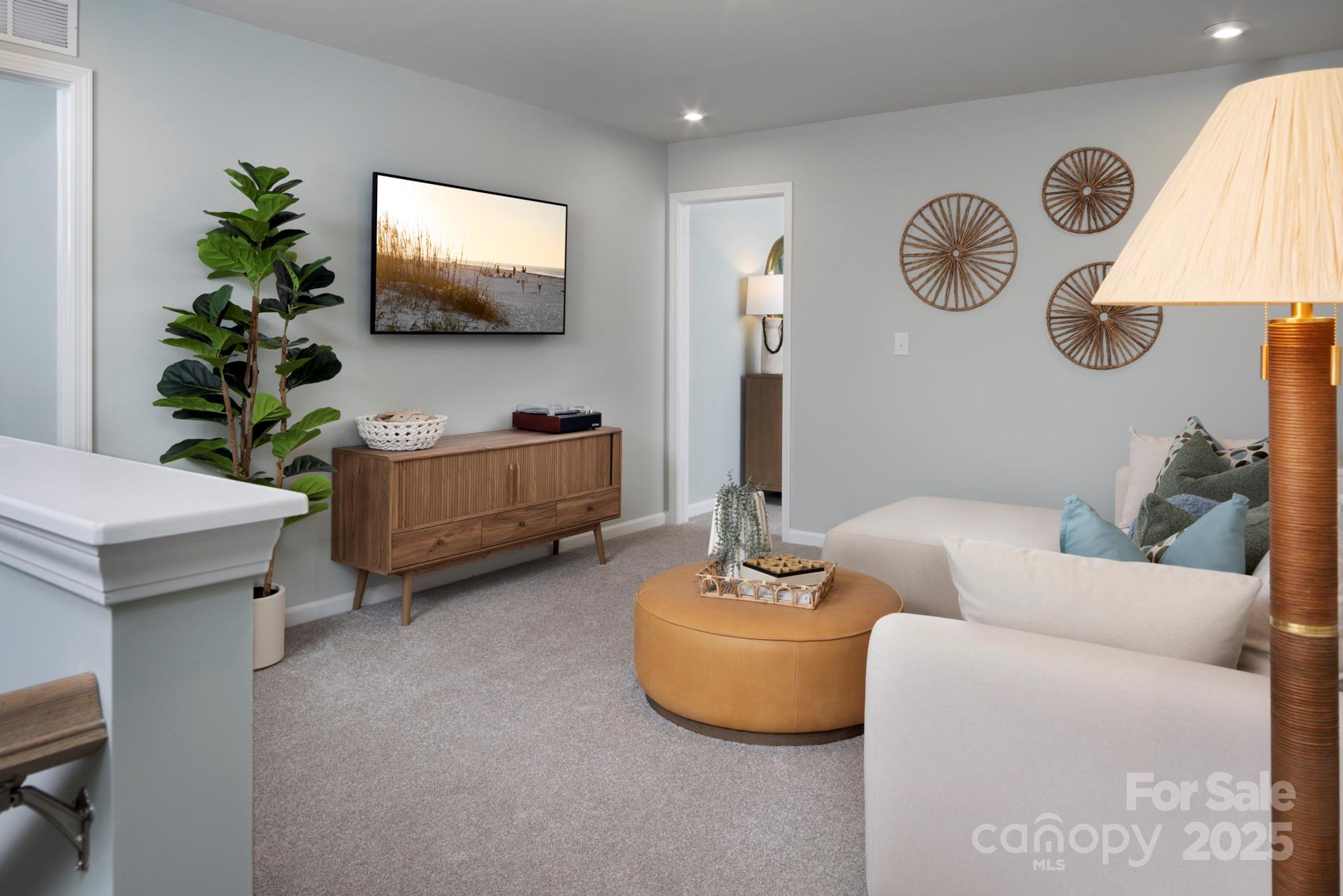 1118 Vibrant Road Charlotte, NC 28215 - Photo 5 of 14 a living room with furniture and a flat screen tv