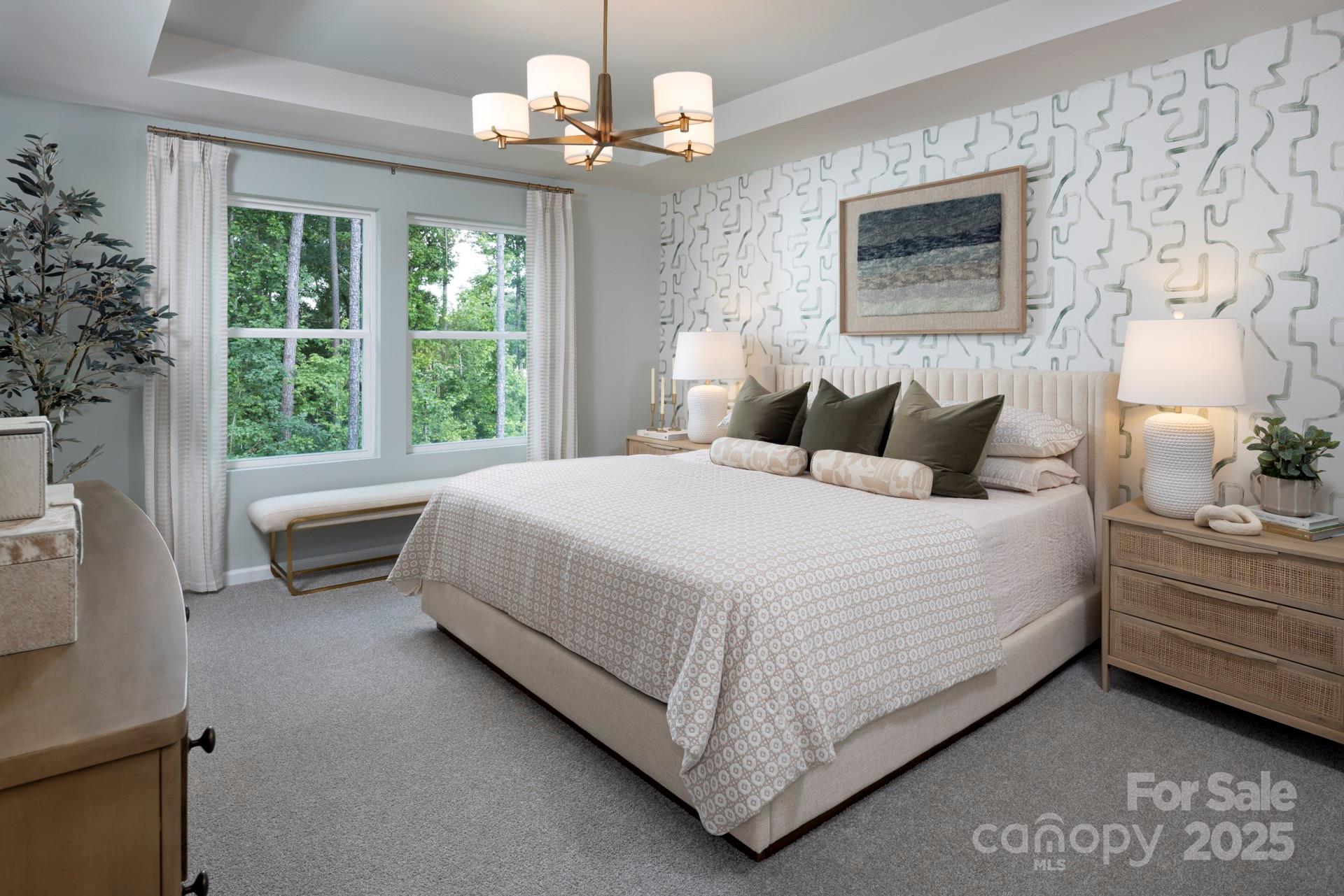 1118 Vibrant Road Charlotte, NC 28215 - Photo 6 of 14 a bedroom with a large bed and a chandelier