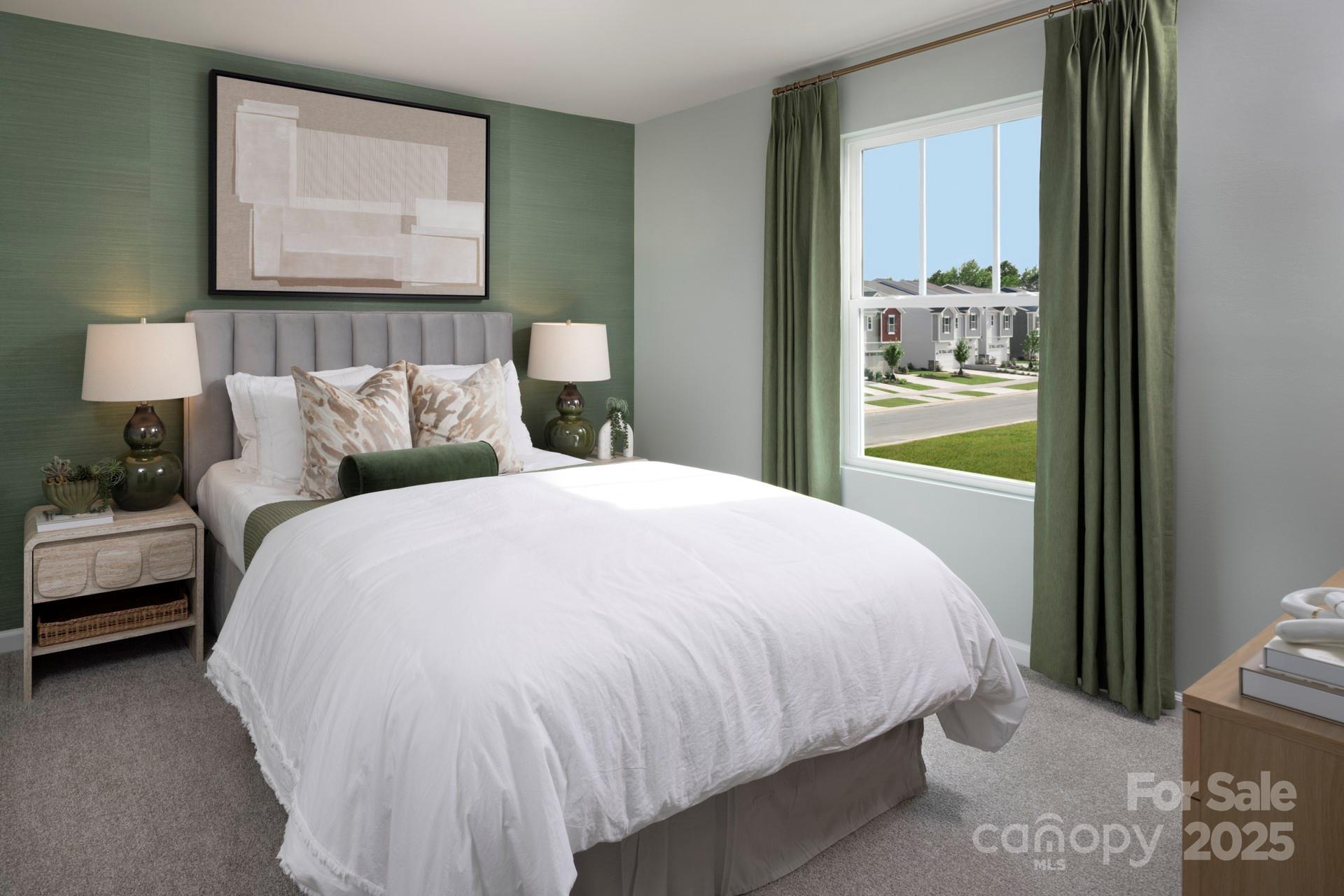 1118 Vibrant Road Charlotte, NC 28215 - Photo 8 of 14 a bed sitting in a bedroom next to a window