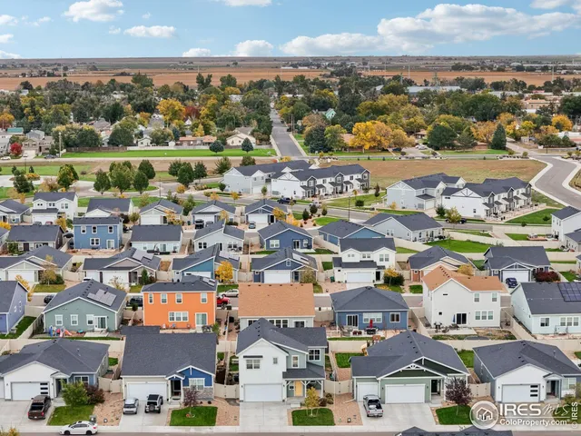 front view of a house with a garden