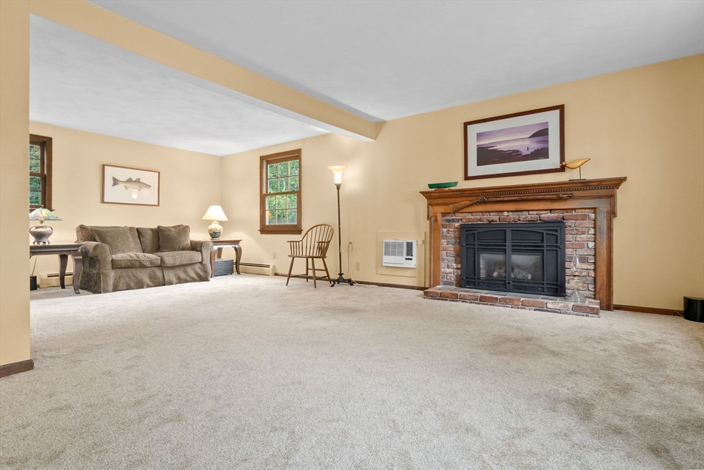 11 Heard Drive Ipswich, MA 01938 - Photo 17 of 41 a living room with furniture and a fireplace