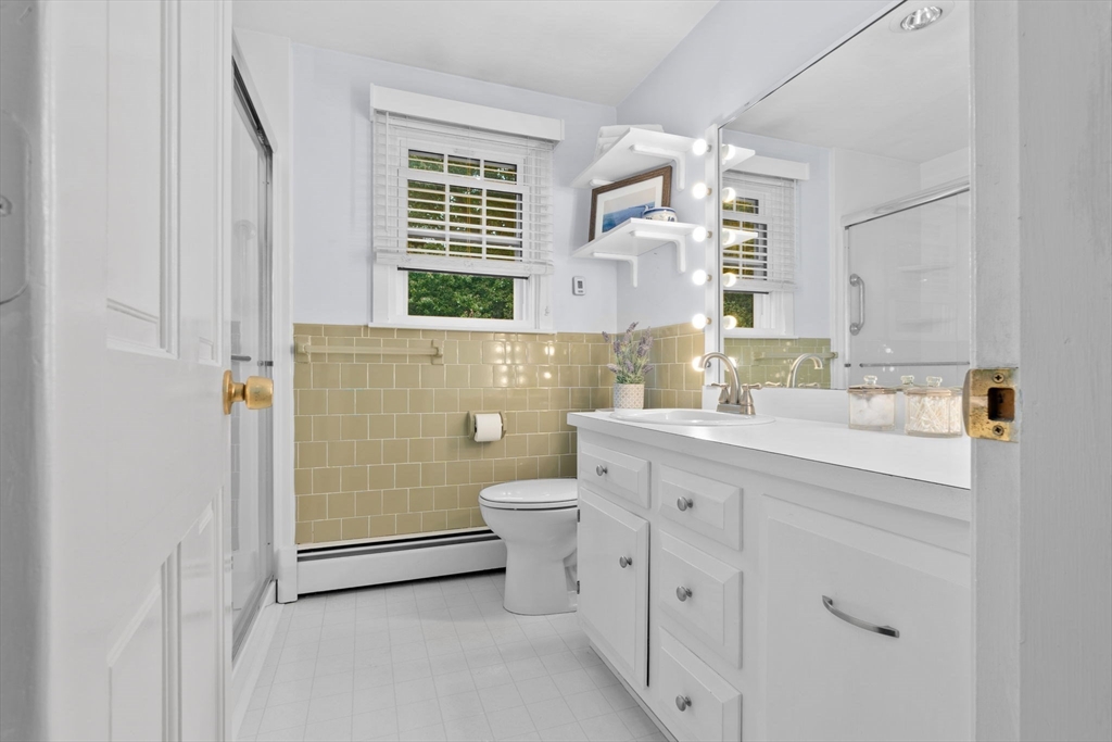 11 Heard Drive Ipswich, MA 01938 - Photo 29 of 41 a bathroom with a sink a toilet and shower