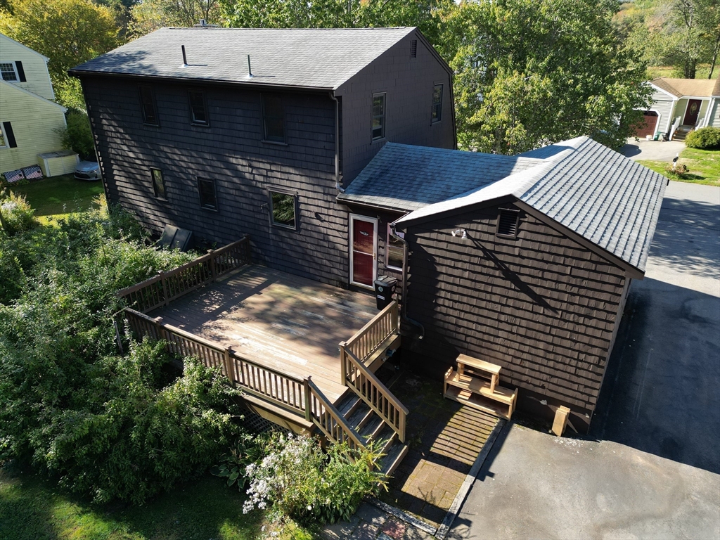 11 Heard Drive Ipswich, MA 01938 - Photo 30 of 41 a view of a patio with table and chairs with wooden floor and fence