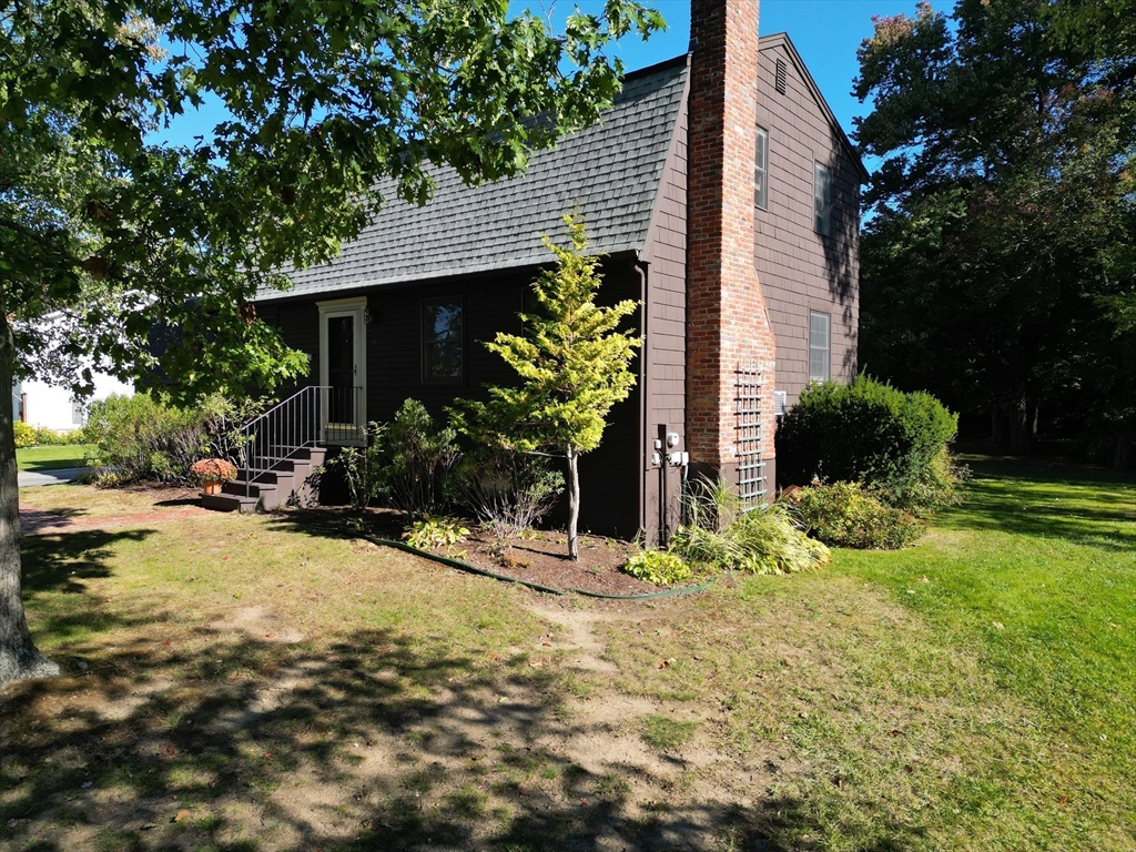 11 Heard Drive Ipswich, MA 01938 - Photo 3 of 41 a view of a house with yard and plants