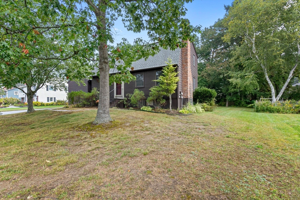 11 Heard Drive Ipswich, MA 01938 - Photo 32 of 41 a backyard of a house with lots of green space