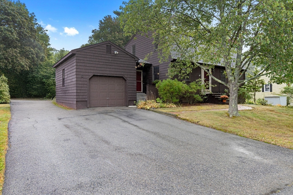 11 Heard Drive Ipswich, MA 01938 - Photo 4 of 41 a front view of a house with a yard and garage