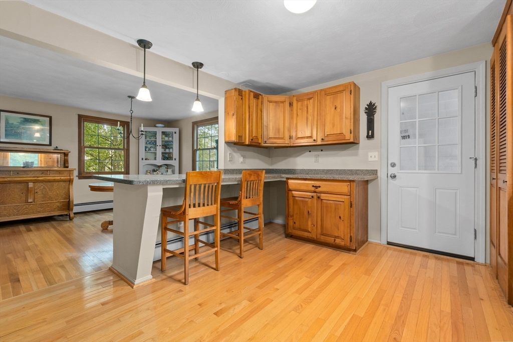 11 Heard Drive Ipswich, MA 01938 - Photo 8 of 41 a kitchen with a sink cabinets and wooden floor
