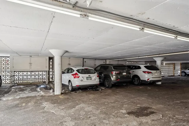 a view of parking garage with cars
