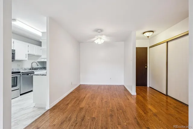 a view of kitchen with wooden floor electronic appliances and window