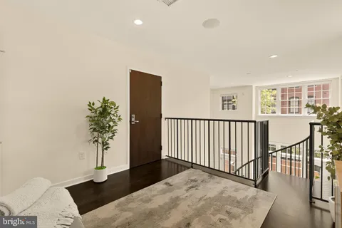 a view of a porch with wooden floor and a potted plant