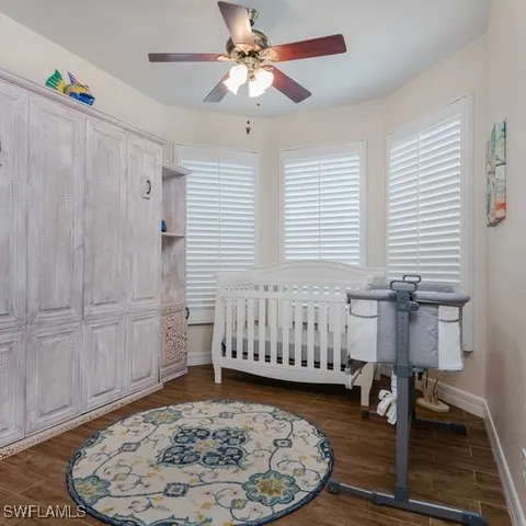 a bedroom with a bed and a table