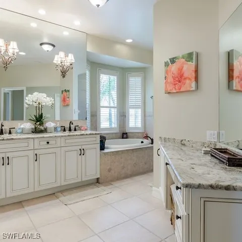 a kitchen with granite countertop a sink and a stove