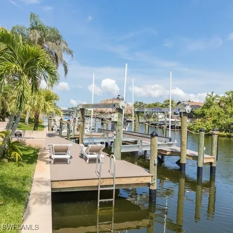 a view of house with swimming pool yard and outdoor seating
