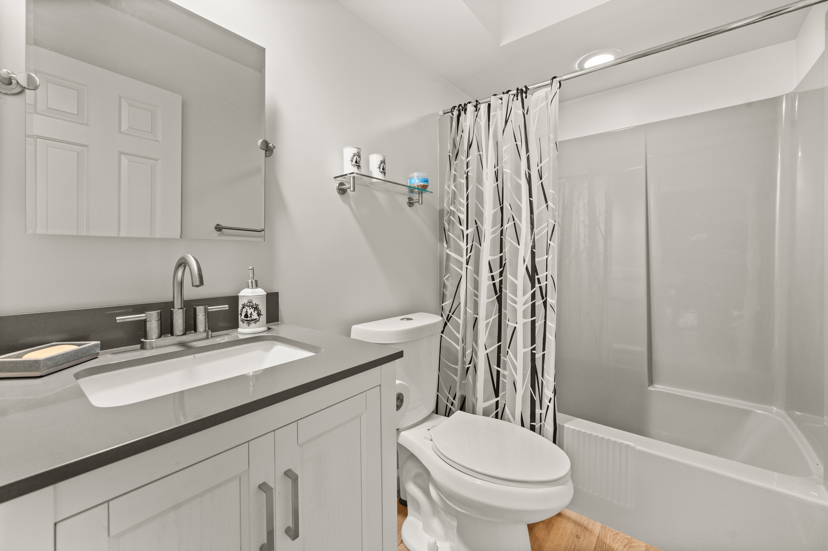 8510 Gurler Road DeKalb, IL 60115 - Photo 17 of 46 a bathroom with a granite countertop sink toilet and shower