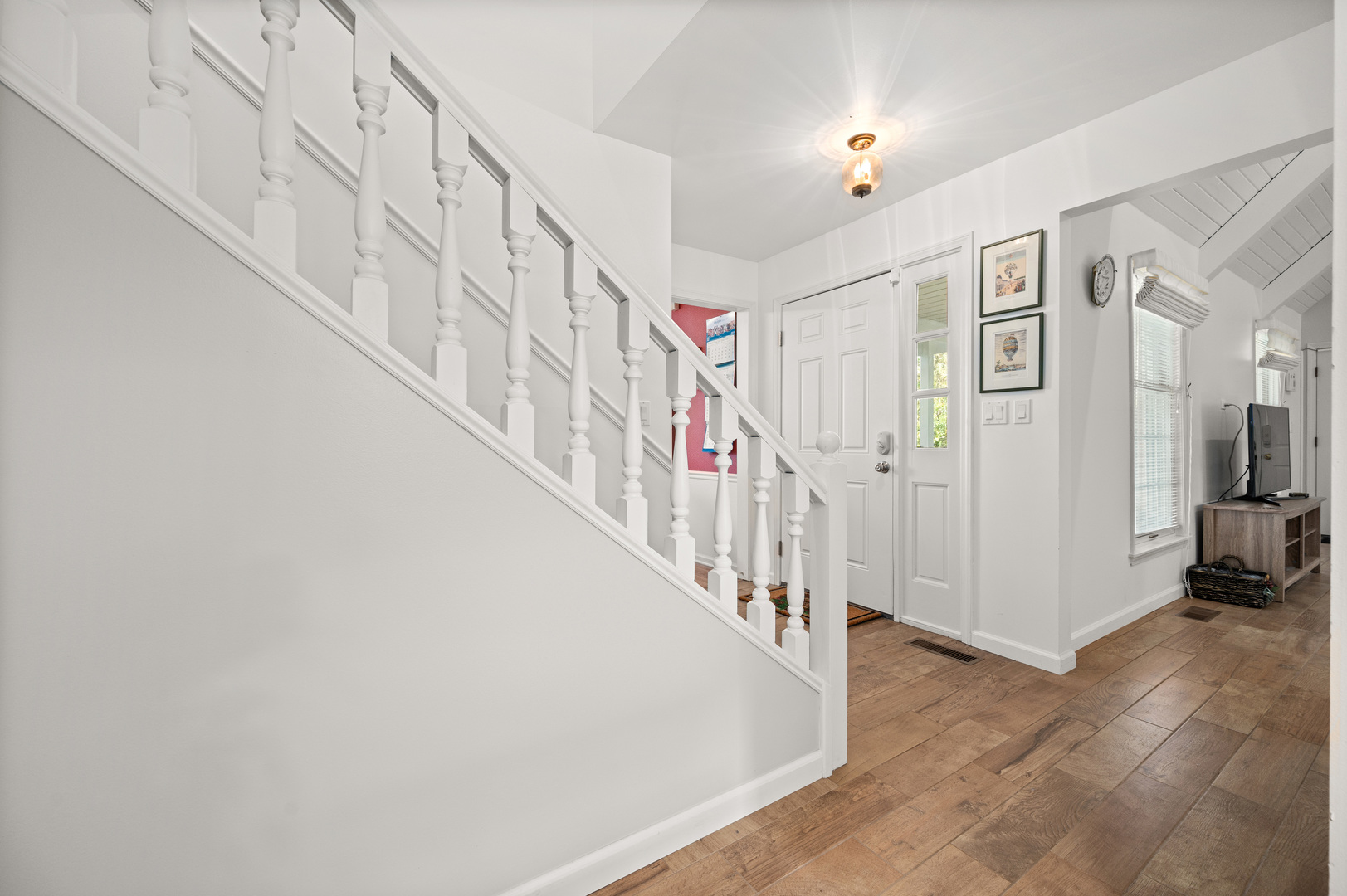 8510 Gurler Road DeKalb, IL 60115 - Photo 18 of 46 a view of staircase with lots of frames on wall and a dining table