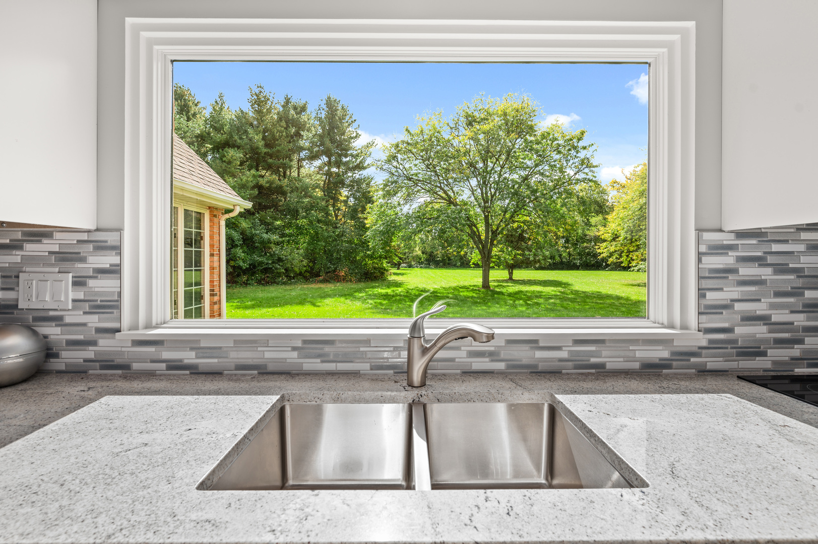 8510 Gurler Road DeKalb, IL 60115 - Photo 8 of 46 a view of a kitchen that has a sink and a window