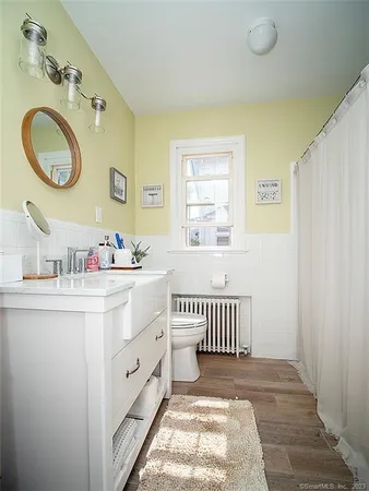a spacious bathroom with a double vanity sink and a mirror