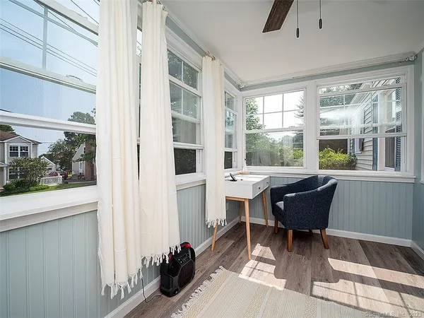 a living room with furniture and a window