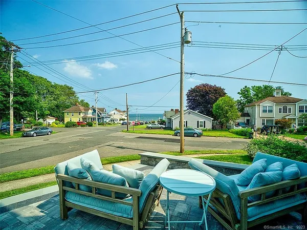 a view of yard with seating area and barbeque oven