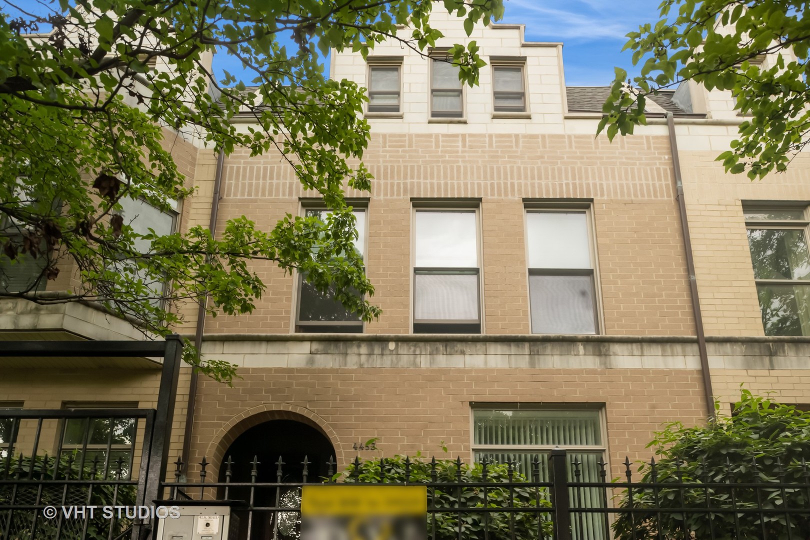 4453 South Berkeley Avenue, Unit 1 Chicago, IL 60653 - Photo 1 of 15 a front view of a house with plants