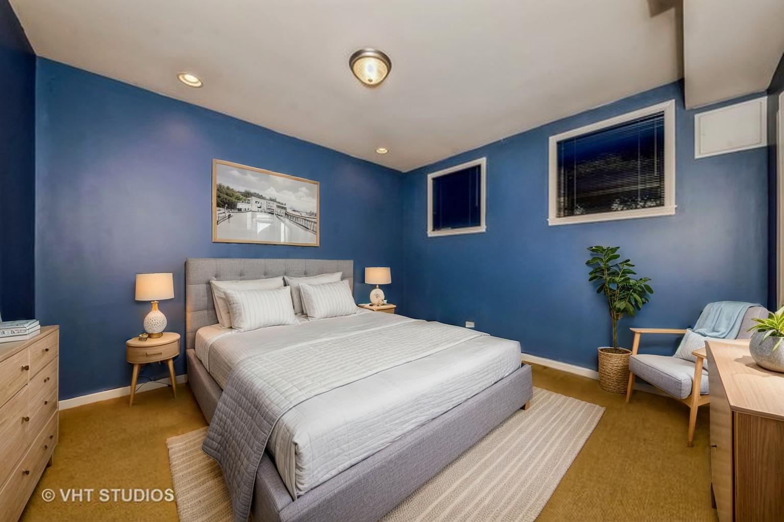 4453 South Berkeley Avenue, Unit 1 Chicago, IL 60653 - Photo 12 of 15 a bedroom with a bed and furniture