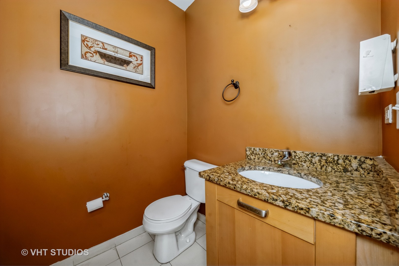 4453 South Berkeley Avenue, Unit 1 Chicago, IL 60653 - Photo 15 of 15 a bathroom with a granite countertop toilet and a sink