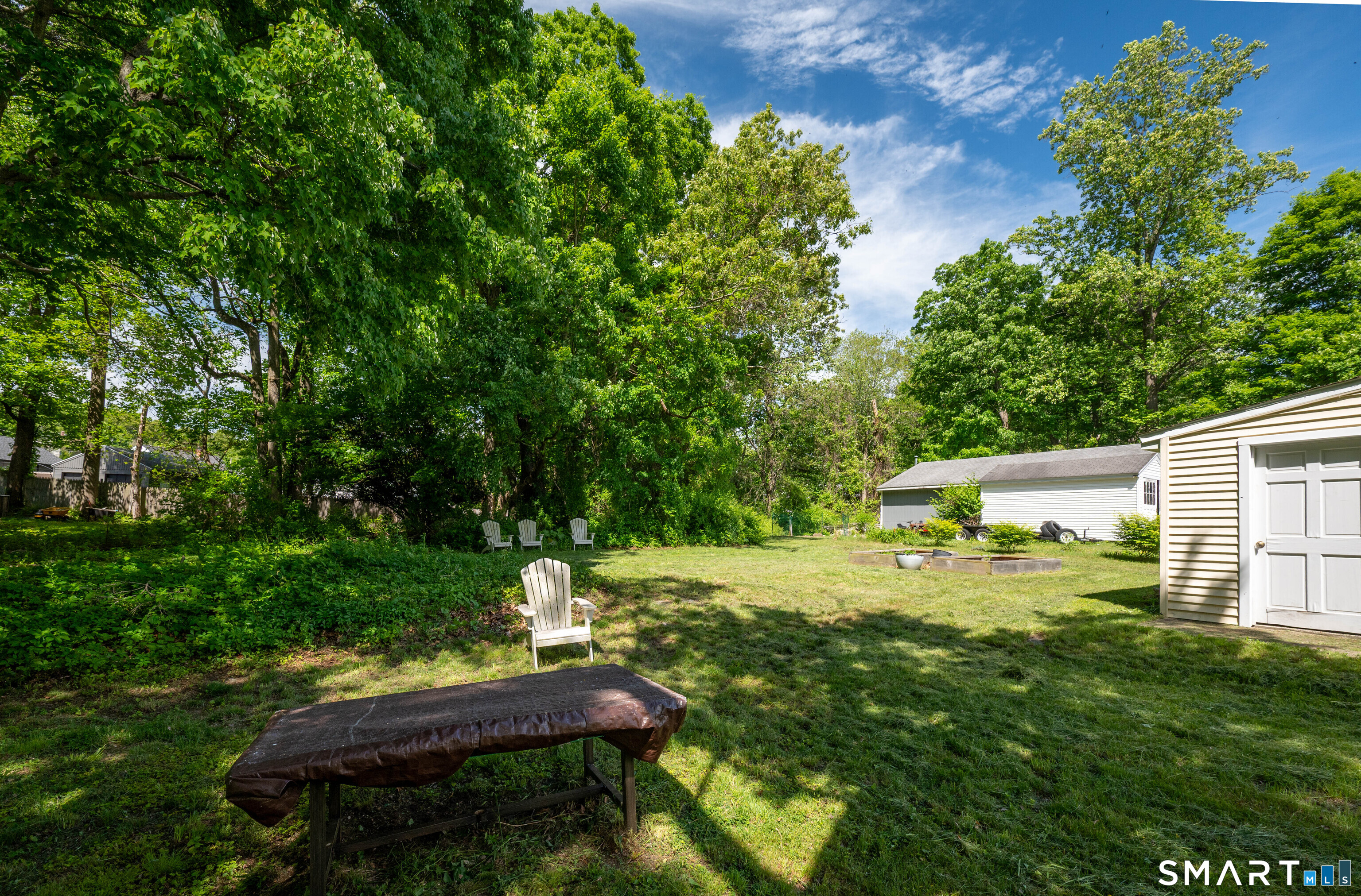 120 May Street Naugatuck, CT 06770 - Photo 30 of 31 a backyard of a house with yard and outdoor seating