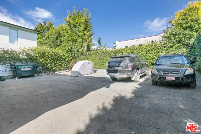 a view of a car parked in back of a house
