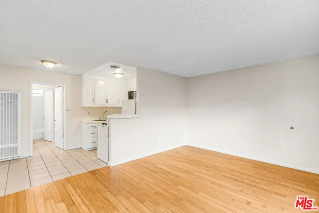a large white bed in a white room