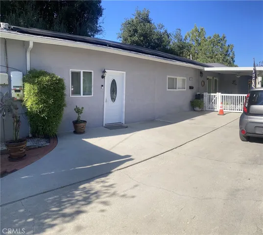 a backyard of a house with seating space