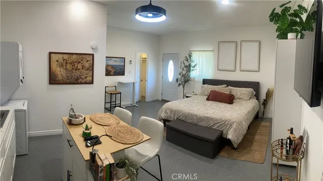 a bedroom with a bed and a table in it