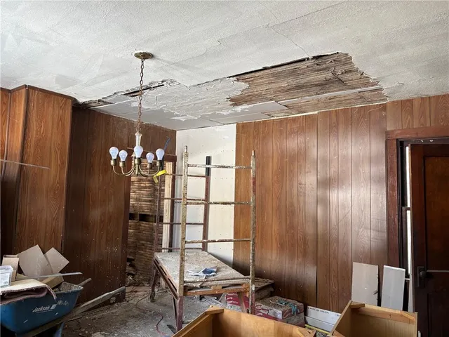 a room with furniture and chandelier