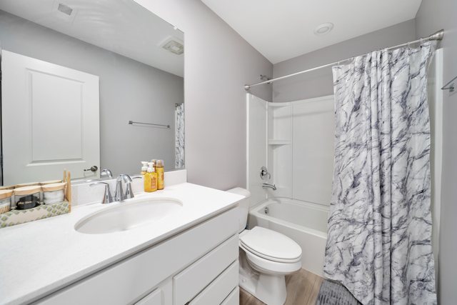 1004 Atterberg Road South Elgin, IL 60177 - Photo 15 of 22 a bathroom with a sink toilet and shower
