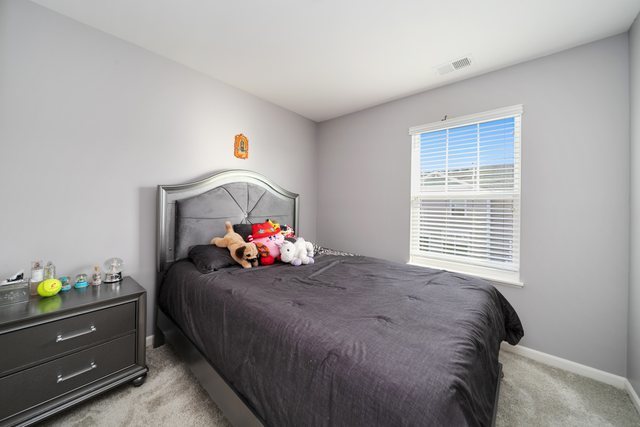 1004 Atterberg Road South Elgin, IL 60177 - Photo 16 of 22 a bedroom with a bed and a window