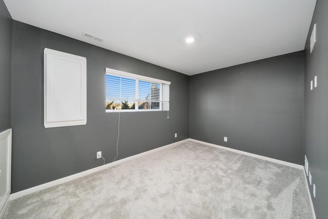 1004 Atterberg Road South Elgin, IL 60177 - Photo 19 of 22 a view of an empty room with a window