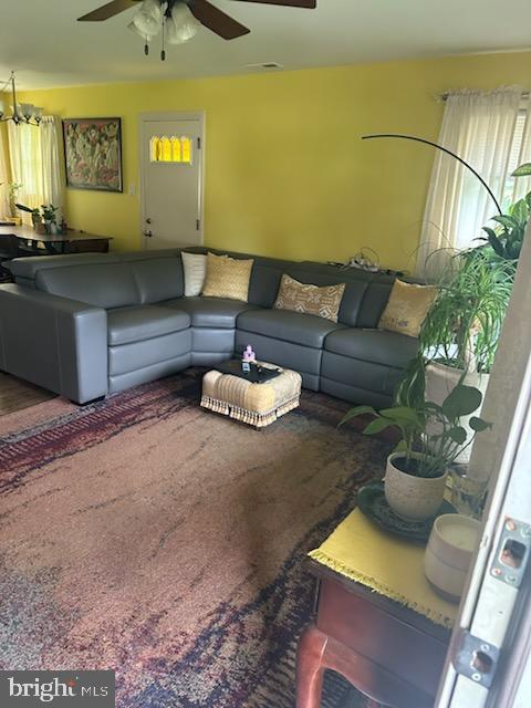 9011 Spring Acres Road Clinton, MD 20735 - Photo 5 of 11 a living room with furniture and a potted plant