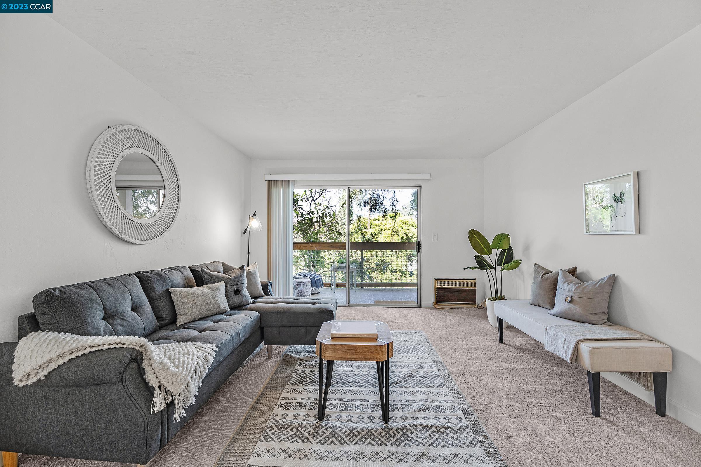 4081 Clayton Road, Unit 332 Concord, CA 94521 - Photo 1 of 1 a living room with furniture and a large window