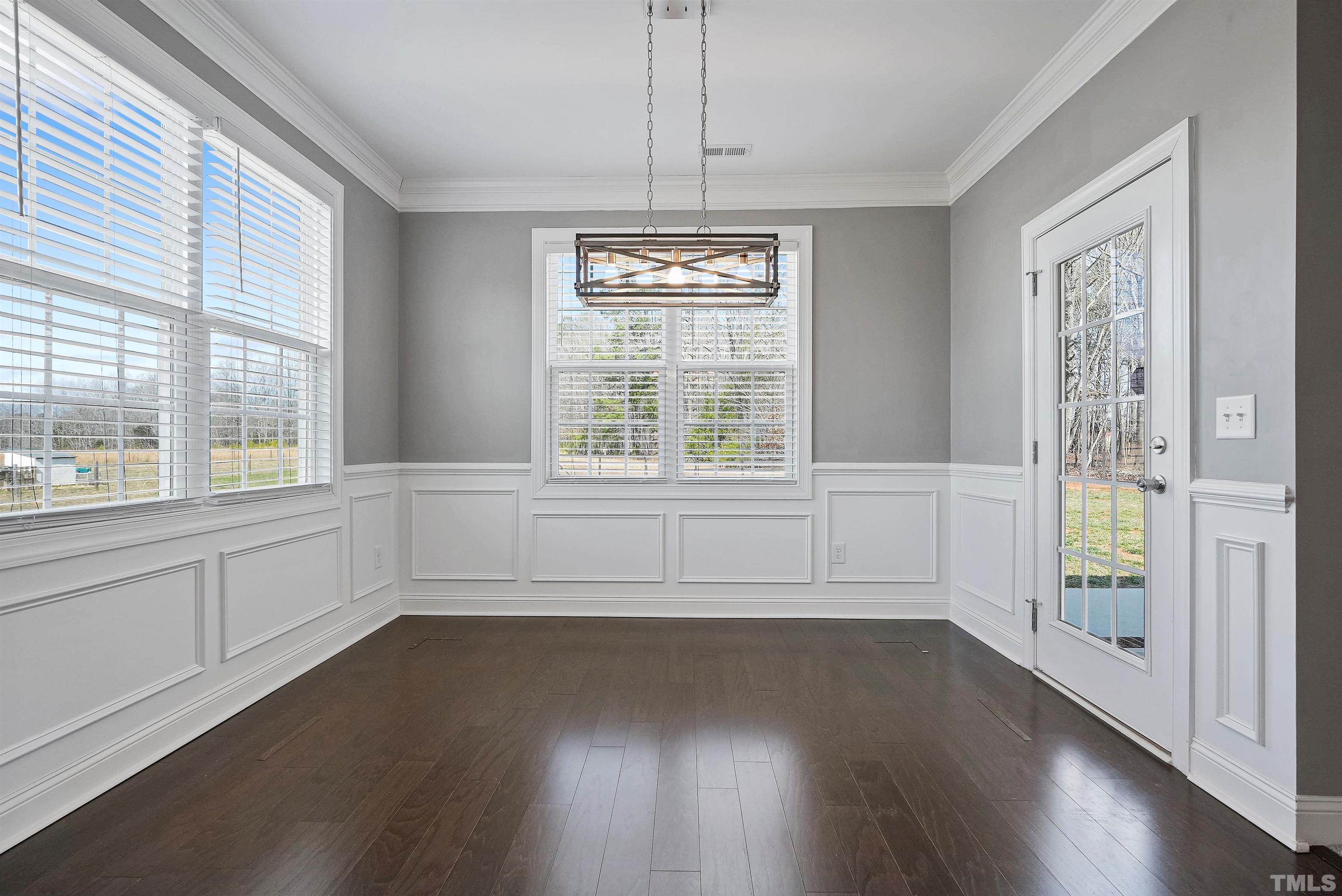 4085 Old 75 Highway Stem, NC 27581 - Photo 12 of 36 a view of an empty room with wooden floor and a window