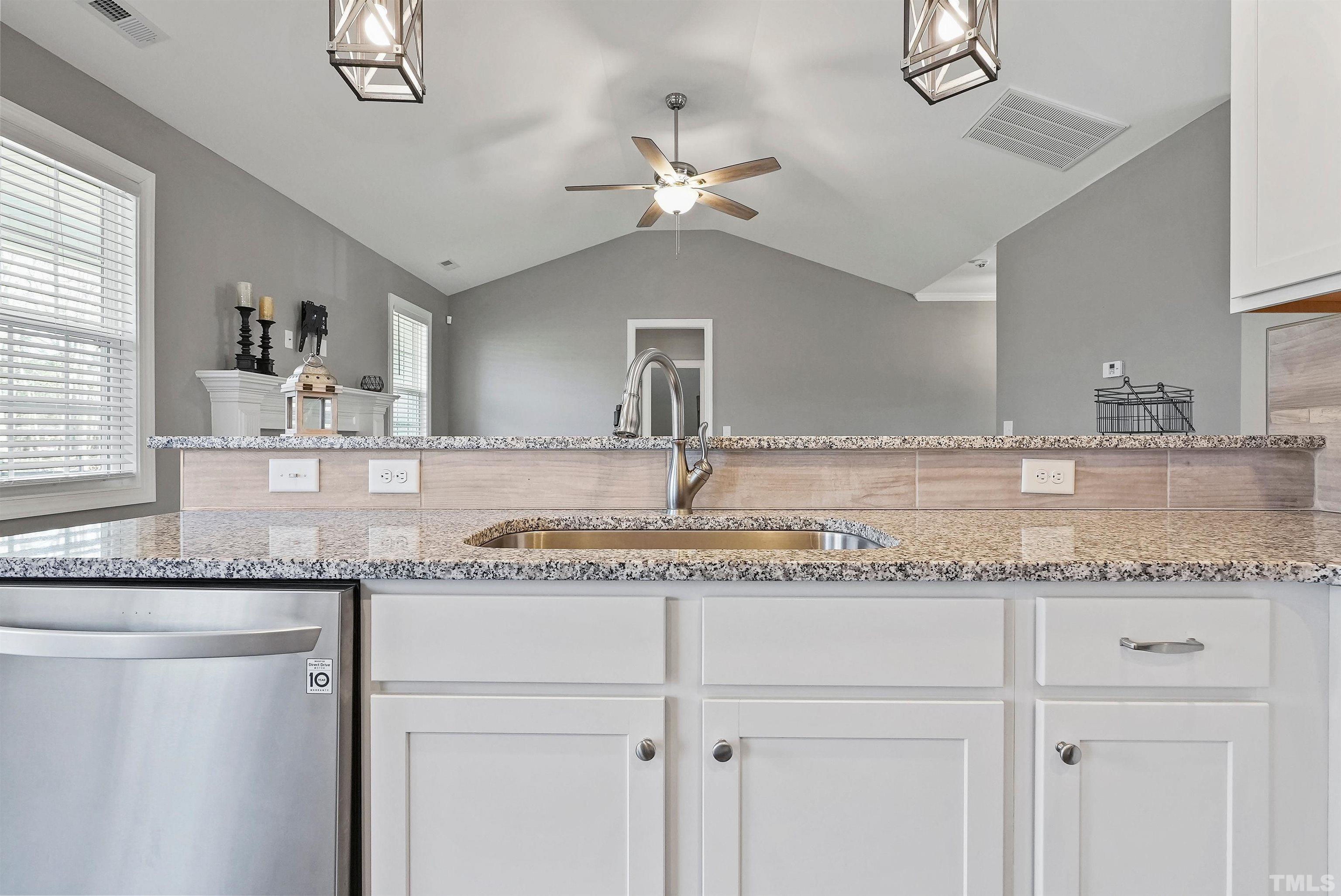 4085 Old 75 Highway Stem, NC 27581 - Photo 13 of 36 a bathroom with sink granite and a mirror