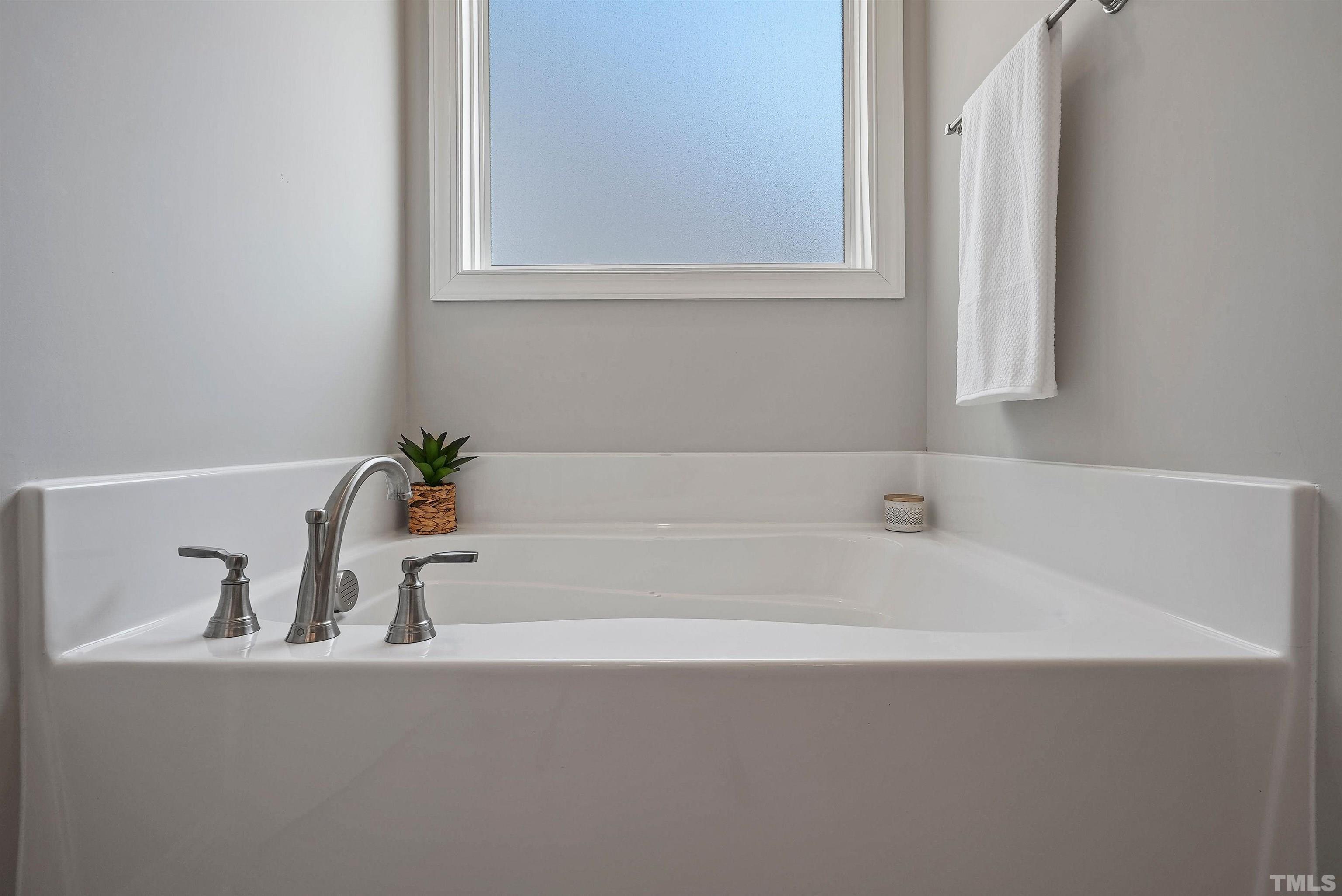 4085 Old 75 Highway Stem, NC 27581 - Photo 20 of 36 a white bath tub sitting next to a window
