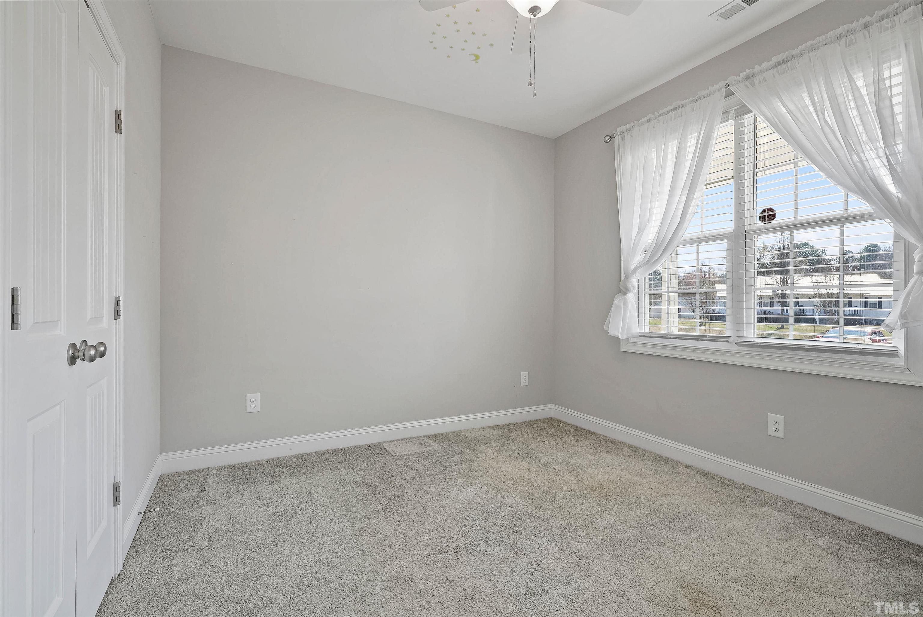 4085 Old 75 Highway Stem, NC 27581 - Photo 21 of 36 an empty room with windows