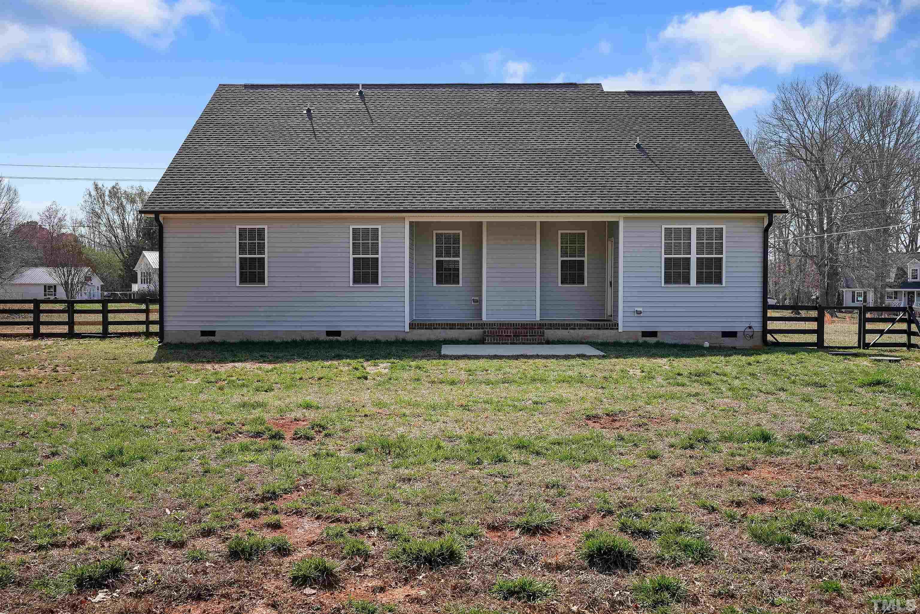 4085 Old 75 Highway Stem, NC 27581 - Photo 29 of 36 a front view of a house with garden