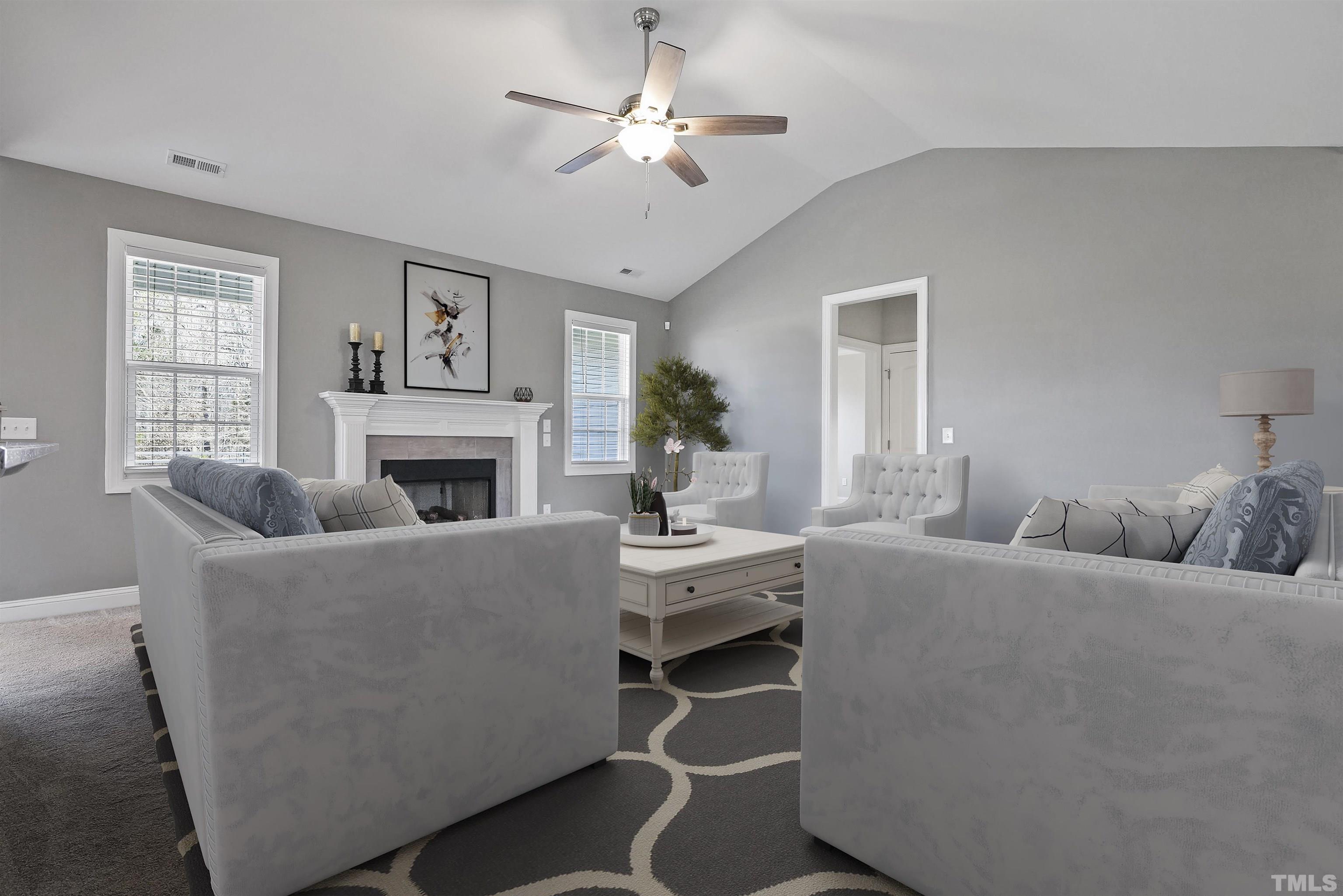 4085 Old 75 Highway Stem, NC 27581 - Photo 6 of 36 a living room with furniture and a fireplace